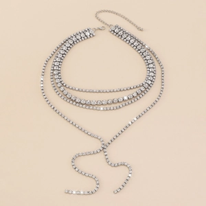 Detail of a multi-layer rhinestone choker with long tassel fringe for party wear
