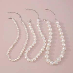 Detailed comparison of three pearl necklaces with silver lobster clasps in small to large sizes