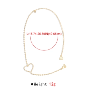 Detail of gold butterfly body chain with heart rhinestone and 40-65cm size measurements