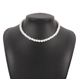Elegant white round pearl choker necklace displayed on a black bust mannequin