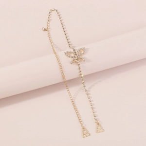 Detailed view of elegant butterfly body chain with golden finish and sparkling rhinestones