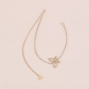 Detailed view of elegant gold butterfly body chain with sparkling rhinestone crystals