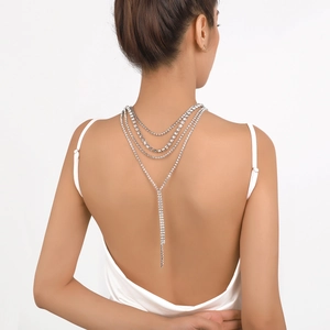 Detailed back view of layered silver rhinestone back necklace for evening gowns
