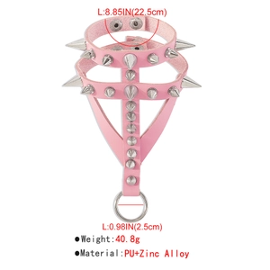 Detail of pink PU leather punk bracelet featuring metal spikes and hanging round ring