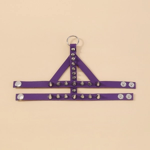 Detail of purple gothic leather cuff with silver metal rivets and adjustable snap buttons