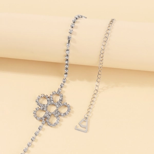 Macro shot of silver crystal flower body chain with intricate rhinestone detailing