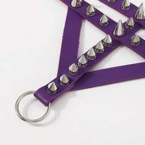 Macro view of purple leather punk bracelet featuring silver metal studs and polished ring