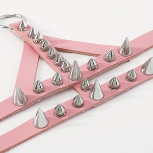 Close-up of pink PU leather choker with silver metal punk rivets and ring details