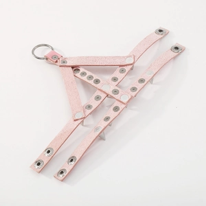 Detailed macro view of pink PU leather cuff featuring silver metal spikes and rivet accents