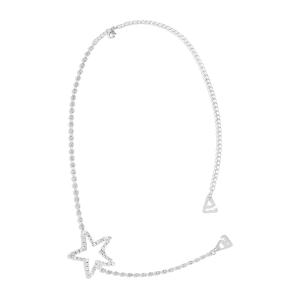 Macro detail of sparkly star body chain with rhinestones and silver butterfly accents
