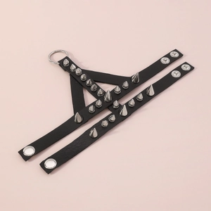 Detail of Gothic punk leather bracelet featuring silver metal spikes and round rivets