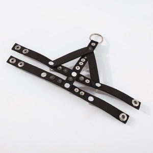 Detail of gothic punk PU leather bracelet with silver rivets and metal rings on white background