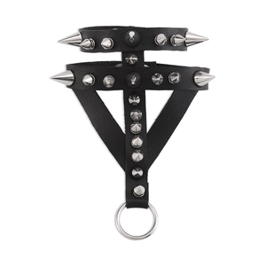 Detailed macro view of black punk leather harness with silver spikes and metal ring