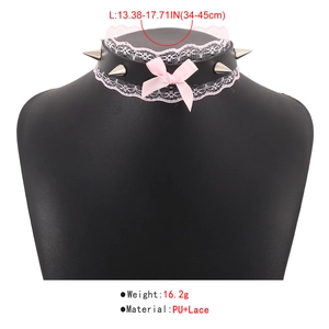 Detail of punk PU leather choker with pink lace, satin bow, and silver cone studs