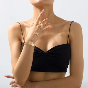 Detail of a vintage gold butterfly hand harness with rings and bracelet chain link