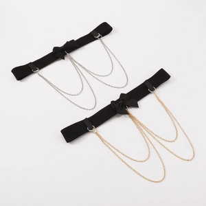 Detail of sexy black bow leg ring with multi-layer metal chain fringe in gold and silver