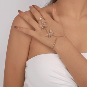 Golden butterfly finger bracelet with layered chains and elegant gothic butterfly charms