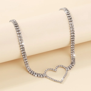 Close-up of double-row rhinestone heart necklace with silver claw chain detail