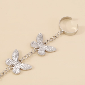 Silver butterfly slave bracelet featuring detailed wings and adjustable ring chain