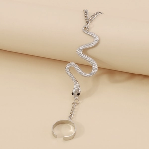 Close-up of silver snake slave bracelet with detailed scales and adjustable ring