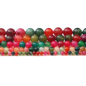 Macro shot of colorful dragon vein agate round beads in five sizes for DIY jewelry