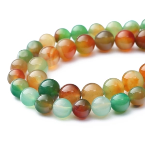 Macro detail of polished translucent multi-color agate beads for DIY jewelry making