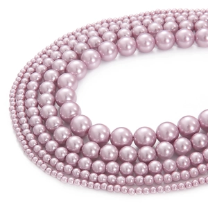 Macro detail of high-luster lavender glass pearls in various sizes for DIY jewelry making