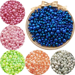 Detail of colorful mixed 3-8mm faux pearls with pre-drilled holes for DIY jewelry