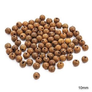 Close-up of 10mm natural wenge wood beads with distinct striped grain for DIY jewelry
