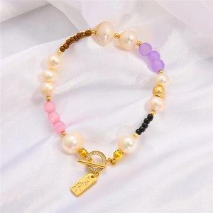 Detail of 18k gold-plated OT toggle clasp and handmade tag for pearl necklaces