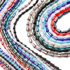 Spiral arrangement of faceted glass pagoda beads in vibrant colors for DIY jewelry making