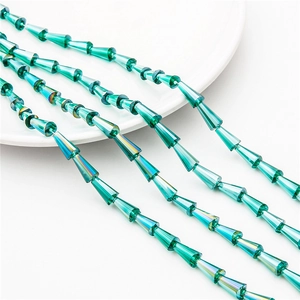 Close-up of emerald faceted crystal glass tower beads for DIY jewelry making