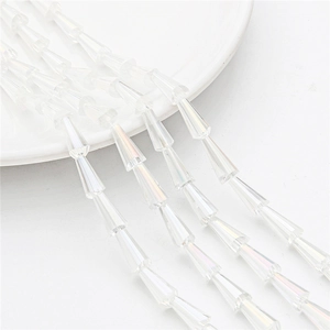 Macro view of transparent faceted glass tower beads arranged in rows for DIY jewelry making