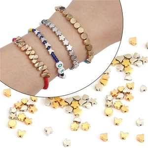 Assorted gold and silver CCB plastic beads in star, heart, and flower shapes for DIY jewelry