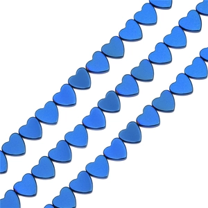Detail view of blue heart-shaped hematite beads for DIY jewelry making and crafts