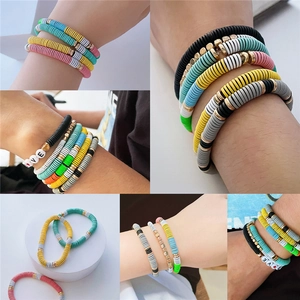 Bohemian colorful heishi clay bead bracelets with gold accents and LOVE letter beads