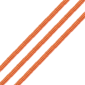 Close-up of matte orange Heishi beads for DIY jewelry making and handmade necklaces
