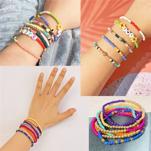 Bohemian seed bead bracelet set with gold accents and colorful heart charms for DIY jewelry