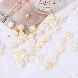 Macro view of acrylic rose beads with pearl luster for DIY jewelry making and crafts
