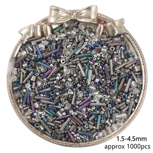 Macro shot of mixed 1.5-4.5mm glass beads with metallic finish for jewelry making