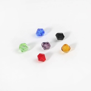 Macro shot of multi-colored 4mm bicone crystal beads for DIY jewelry making and craft projects