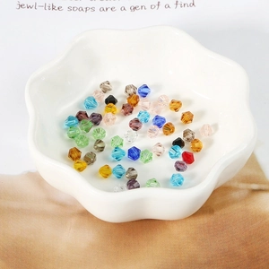 Detailed view of multi-color 4mm faceted bicone crystal beads for DIY jewelry making