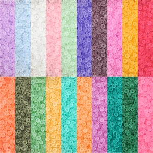 Detailed grid of frosted translucent DIY seed beads in 20 vibrant assorted colors