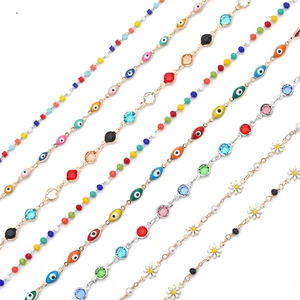 Handmade copper jewelry chains with evil eye beads and daisy charms for DIY necklaces
