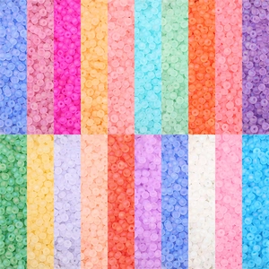 Macro shot of colorful matte frosted glass seed beads for DIY jewelry making