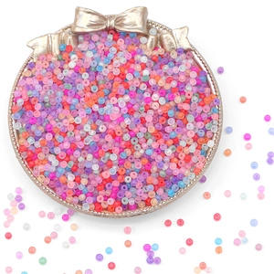 Colorful matte glass seed beads for DIY jewelry making in a decorative gold bowl