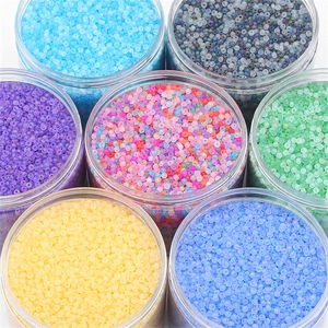 Close-up of 2mm matte glass seed beads in multiple colors for DIY jewelry making