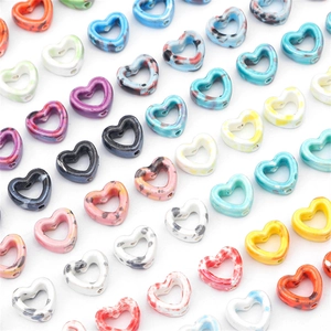 Colorful splash ink ceramic heart beads for DIY jewelry making flat lay collection