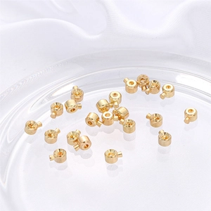 18k gold plated jewelry ends for DIY bracelets on elegant white silk background
