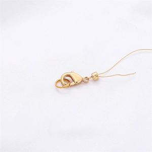 Polished 18k gold lobster clasp with jump ring for DIY jewelry making and bracelet repairs